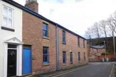 Revised plans to replace engineering workshop with terraced houses