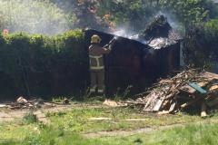 Firefighters extinguish shed fire