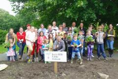 Volunteers and residents come together to plant edible plots