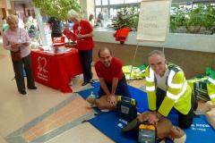 Volunteers demonstrate lifesaving techniques
