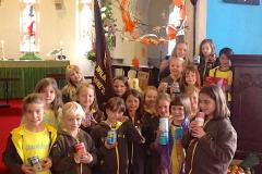 Brownies decorate the church for Harvest Festival