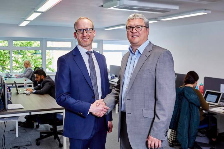 Tony Sellers, right, from Grayce with Orbit's Adam Jackson in new office space