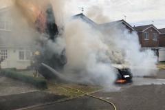 Van fire spreads to nearby tree