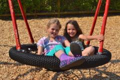 Kids swing into action at new play area