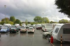 Travellers set up camp in gym car park