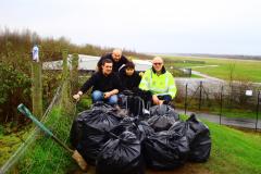 Aviation enthusiasts clean up around airport