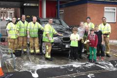 Firefighters earn bucket loads for charity