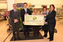 Chancellor presents cheque to bereavement charity
