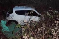 Two people rescued after car crashes 15ft down embankment