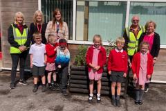 In Bloom volunteers help children add splash of colour to school entrance