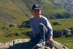 Young fundraiser swaps his running shoes for hiking boots