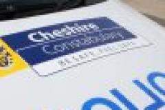Police car rammed at petrol station