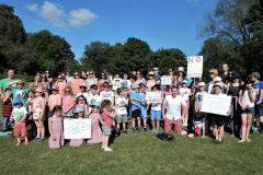 Parents, teachers and children protest over school cuts