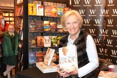 Baking queen signs copies of her latest book