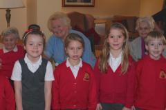 Children bring festive cheer to care home residents