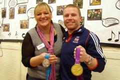 Paralympic medalist draws men to WI meeting