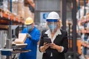 Woman manager in warehouse (Stock)