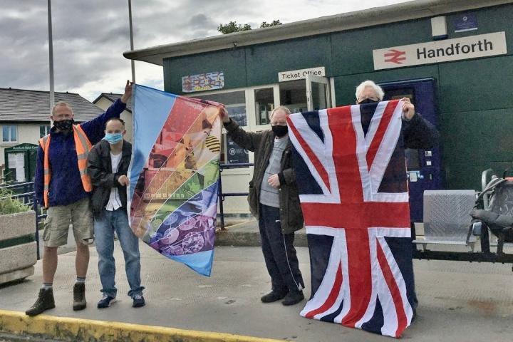 1. TOG and FoHS members display the new flags